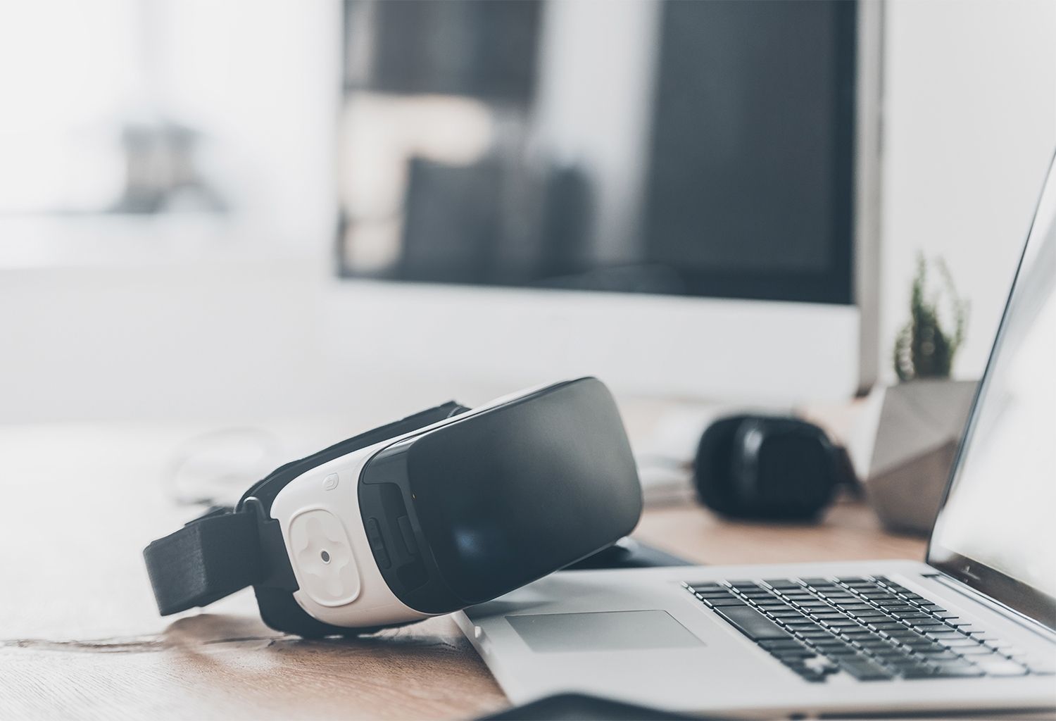 Mac computer with a virtual reality headset.